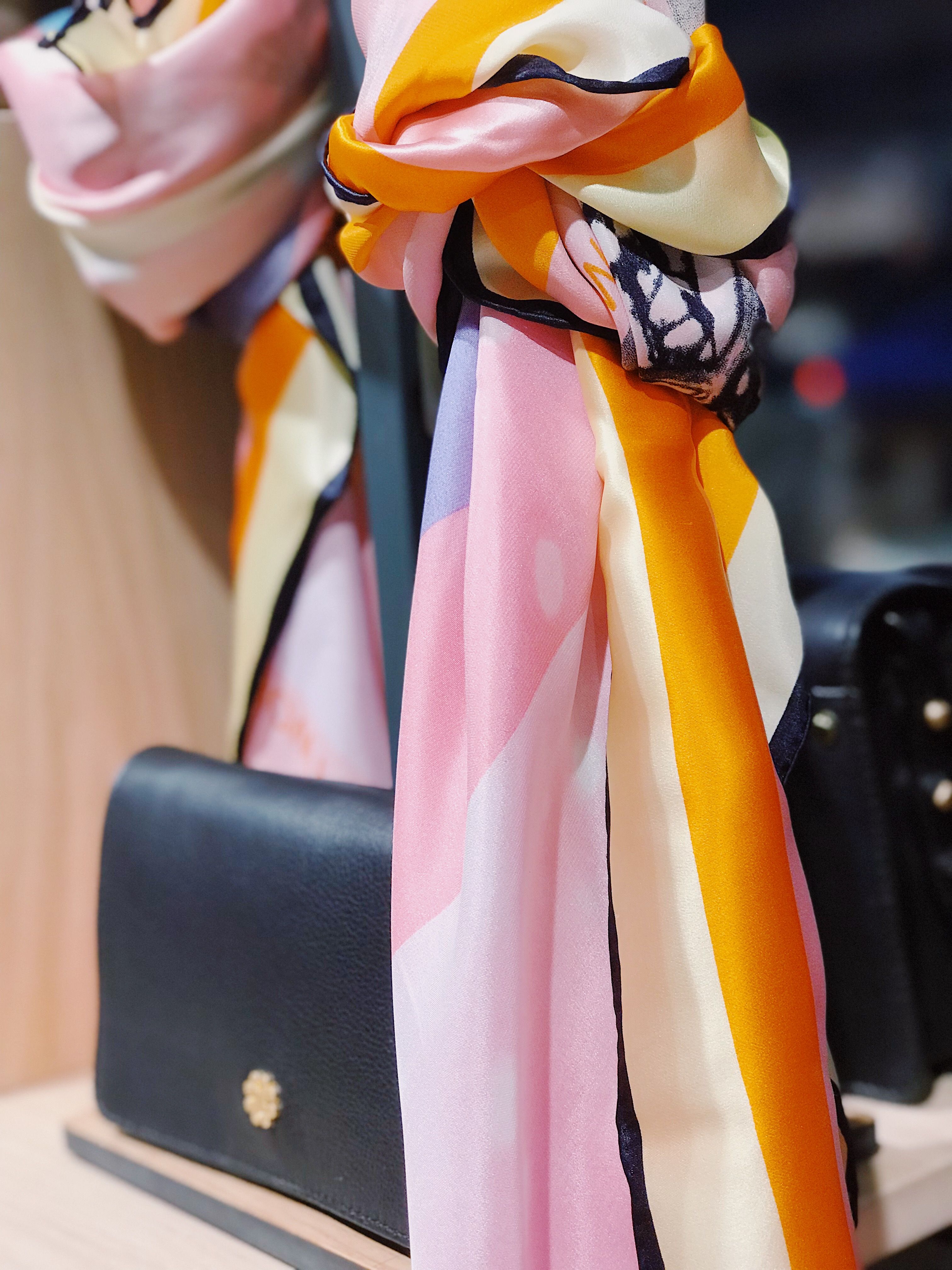 Silk scarf texture in coral and pink tones